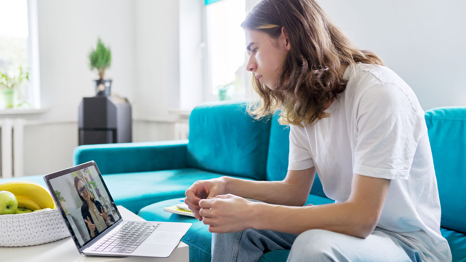 Young Teen taking advice from a RealTalk Counselor during an Online Session.