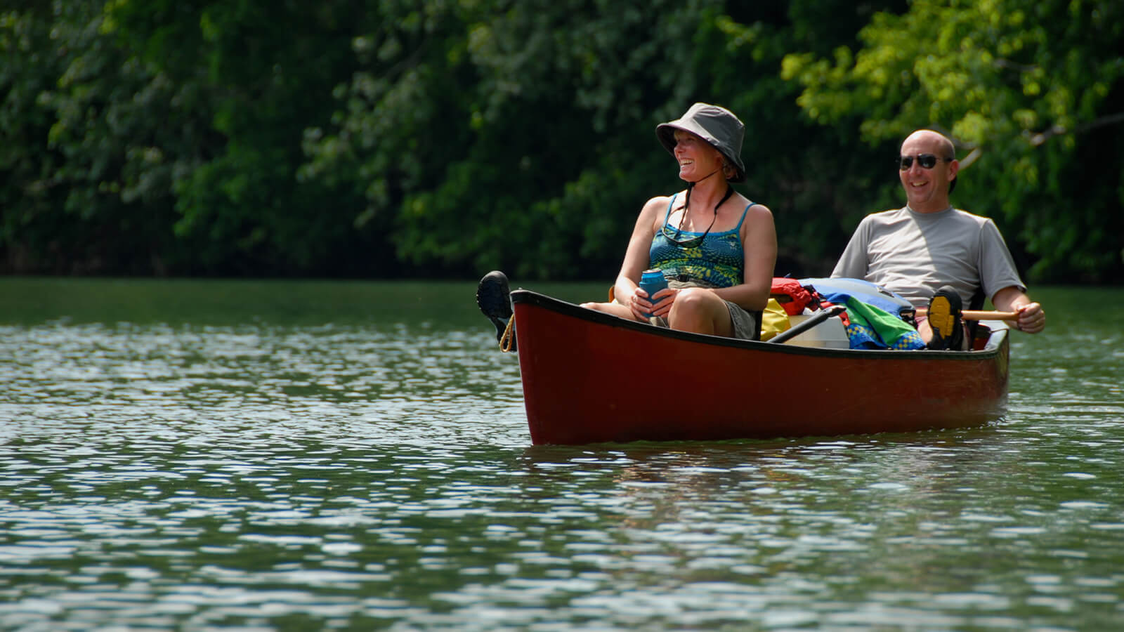 Happy couple canoeing in a river